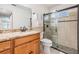 Modern bathroom with granite vanity, updated fixtures, and a glass-enclosed shower at 2755 Merlin Way, Clearwater, FL 33761
