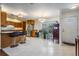 Bright kitchen with stainless steel appliances, eat in space, and an entry to the home at 2755 Merlin Way, Clearwater, FL 33761