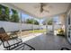 Covered patio with tile flooring and a view of the backyard and fence at 2755 Merlin Way, Clearwater, FL 33761