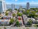 Aerial view of townhouse in a neighborhood near water, and tall buildings at 2920 W El Prado Blvd # 4, Tampa, FL 33629