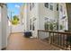 Backyard patio with wood deck and a view of the home's exterior at 2920 W El Prado Blvd # 4, Tampa, FL 33629