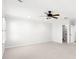 Large bedroom featuring a ceiling fan, neutral carpet and large windows for plenty of natural light at 2920 W El Prado Blvd # 4, Tampa, FL 33629
