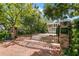 Elegant gated community entrance with brick signage and lush greenery at 2920 W El Prado Blvd # 4, Tampa, FL 33629