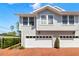 Charming townhome with a two-car garage, private entrance, and manicured landscaping at 2920 W El Prado Blvd # 4, Tampa, FL 33629