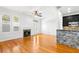 Bright living room features hardwood floors, fireplace, and an open layout to the kitchen at 2920 W El Prado Blvd # 4, Tampa, FL 33629