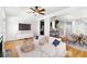 Open-concept living room with a fireplace, bar seating and adjacent dining area at 2920 W El Prado Blvd # 4, Tampa, FL 33629