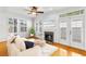 Cozy living room with lots of natural light, fireplace, and access to the outdoors at 2920 W El Prado Blvd # 4, Tampa, FL 33629