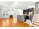 Bright living room featuring a fireplace, hardwood floors and open floor plan to the kitchen at 2920 W El Prado Blvd # 4, Tampa, FL 33629