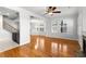 Spacious living area with hardwood floors, fireplace, and open staircase at 2920 W El Prado Blvd # 4, Tampa, FL 33629