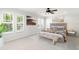 Bright main bedroom with carpet, neutral walls, and decorative paintings at 2920 W El Prado Blvd # 4, Tampa, FL 33629