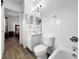 Well-maintained bathroom with tiled walls, modern lighting, and functional design at 30132 Wellesley Way, Wesley Chapel, FL 33543