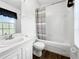 Neat bathroom features shower and tub combination with updated fixtures and a bright window at 30132 Wellesley Way, Wesley Chapel, FL 33543