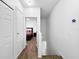 Hallway leads to a bedroom, showcasing the home's layout and connectivity at 30132 Wellesley Way, Wesley Chapel, FL 33543