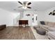 Spacious living room features hardwood floors, staircase and neutral tones at 30132 Wellesley Way, Wesley Chapel, FL 33543