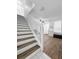 Staircase leads to the living room with lots of natural light at 30132 Wellesley Way, Wesley Chapel, FL 33543