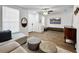 Bright living area with lots of windows, sleek flooring, and modern decor at 30132 Wellesley Way, Wesley Chapel, FL 33543
