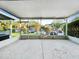 Screened in porch provides a relaxing outdoor space with views of the street and neighborhood at 30132 Wellesley Way, Wesley Chapel, FL 33543