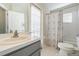 Well-lit bathroom features a single sink vanity and a shower/tub combo at 3138 Clover Blossom Cir, Land O Lakes, FL 34638