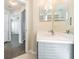 Bathroom featuring a single sink vanity with hardwood floors at 3138 Clover Blossom Cir, Land O Lakes, FL 34638