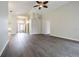 Open living room area featuring hardwood floors and high ceilings at 3138 Clover Blossom Cir, Land O Lakes, FL 34638