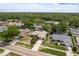 Aerial view of a home with well maintained landscaping, mature trees, and a long driveway at 3388 Tarpon Woods Blvd, Palm Harbor, FL 34685