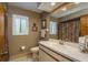 Well-lit bathroom featuring a window with white shutters and a vanity with a white countertop at 3388 Tarpon Woods Blvd, Palm Harbor, FL 34685