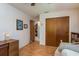 Bedroom featuring a ceiling fan, hardwood floors, closet and a view of another room at 3388 Tarpon Woods Blvd, Palm Harbor, FL 34685