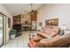 Inviting living room with a stone fireplace, high ceilings, and comfortable seating at 3388 Tarpon Woods Blvd, Palm Harbor, FL 34685