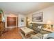 Comfortable living room with wood floors, double doors, and a stylish coffee table at 3388 Tarpon Woods Blvd, Palm Harbor, FL 34685