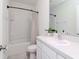 Neutral bathroom with shower and tub combination and a single sink vanity with white countertop at 34355 Sorrel Mint Dr, Wesley Chapel, FL 33543