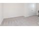 This vacant bedroom features neutral carpet, white trim, a double door closet and fresh paint at 34355 Sorrel Mint Dr, Wesley Chapel, FL 33543