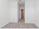 Empty bedroom with neutral paint, neutral carpet and base trim, and a walk-in closet at 34355 Sorrel Mint Dr, Wesley Chapel, FL 33543