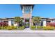 Beautiful community clubhouse with stone accents and lush landscaping, offering a welcoming entrance at 34355 Sorrel Mint Dr, Wesley Chapel, FL 33543