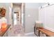 Bright hallway with neutral walls, and decor that leads into an open-concept living space at 34355 Sorrel Mint Dr, Wesley Chapel, FL 33543