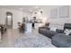 Open-concept living area seamlessly blends the kitchen, dining area and living room at 34355 Sorrel Mint Dr, Wesley Chapel, FL 33543