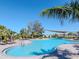 Inviting community pool area with comfortable lounge chairs and shaded areas for relaxation at 34355 Sorrel Mint Dr, Wesley Chapel, FL 33543