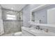 Updated bathroom features a glass enclosed shower with decorative tile and modern fixtures at 3808 97Th N Ave, Pinellas Park, FL 33782