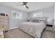 Cozy bedroom with plush carpet, plantation shutters and soft, soothing color palette at 3808 97Th N Ave, Pinellas Park, FL 33782