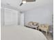Comfortable bedroom features a double door closet, neutral decor, and ceiling fan at 3808 97Th N Ave, Pinellas Park, FL 33782