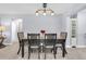 Comfortable dining room with an updated light fixture and neutral decor at 3808 97Th N Ave, Pinellas Park, FL 33782