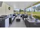 Screened lanai featuring ample seating and a view of the lush landscaped grounds at 3808 97Th N Ave, Pinellas Park, FL 33782