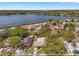 Scenic aerial shot of property near lake with charming neighborhood and lush trees at 408 Pineapple St, Tarpon Springs, FL 34689