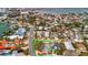 Aerial view of house located in a neighborhood with a beach and bay nearby at 4151 Belle Vista Dr, St Pete Beach, FL 33706
