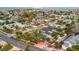 Picturesque aerial view of a residential neighborhood featuring verdant landscaping and unique home designs at 4151 Belle Vista Dr, St Pete Beach, FL 33706
