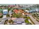 Aerial view capturing a home's proximity to the waterfront, combining tranquil living with city amenities at 4151 Belle Vista Dr, St Pete Beach, FL 33706