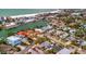 Gorgeous aerial view of waterfront homes and vibrant community near beach, offering serene coastal living and city access at 4151 Belle Vista Dr, St Pete Beach, FL 33706