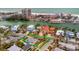 Aerial view showcases the house in proximity to the beach, hotels, and intercoastal waterways at 4151 Belle Vista Dr, St Pete Beach, FL 33706