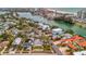 Aerial view of a residential neighborhood by the water, featuring lush greenery and serene streets at 4151 Belle Vista Dr, St Pete Beach, FL 33706