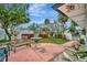 Charming backyard featuring a patio, seating, and a neatly maintained grassy area at 4151 Belle Vista Dr, St Pete Beach, FL 33706