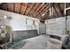 Spacious garage with ample storage, exposed rafters, and an automatic door at 4151 Belle Vista Dr, St Pete Beach, FL 33706